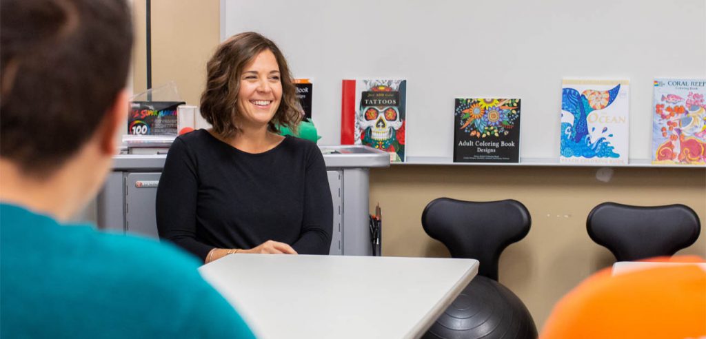 DSS counselor in the ARISE Lab smiling at her students