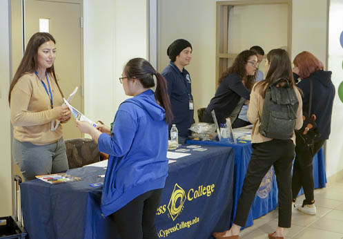 A photo of Fullerton College and Cypress College hosting a resource table at NOCE.