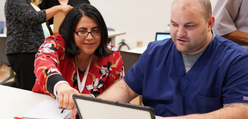 A Career Resource Center instructor helping a student