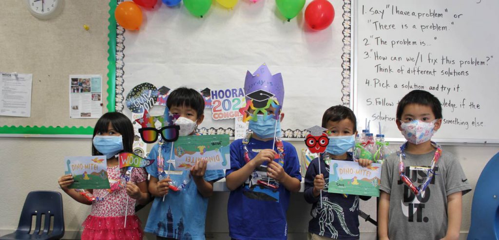 The children graduating from the joyful parenting class posing together for photo