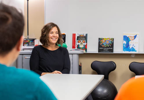 DSS counselor in the ARISE Lab smiling at her students