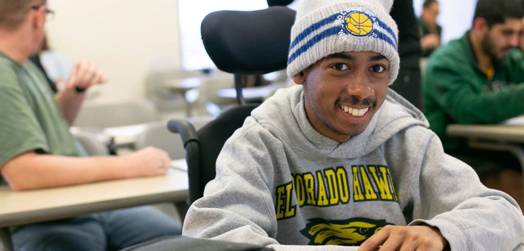 Smiling DSS student in their classroom. 