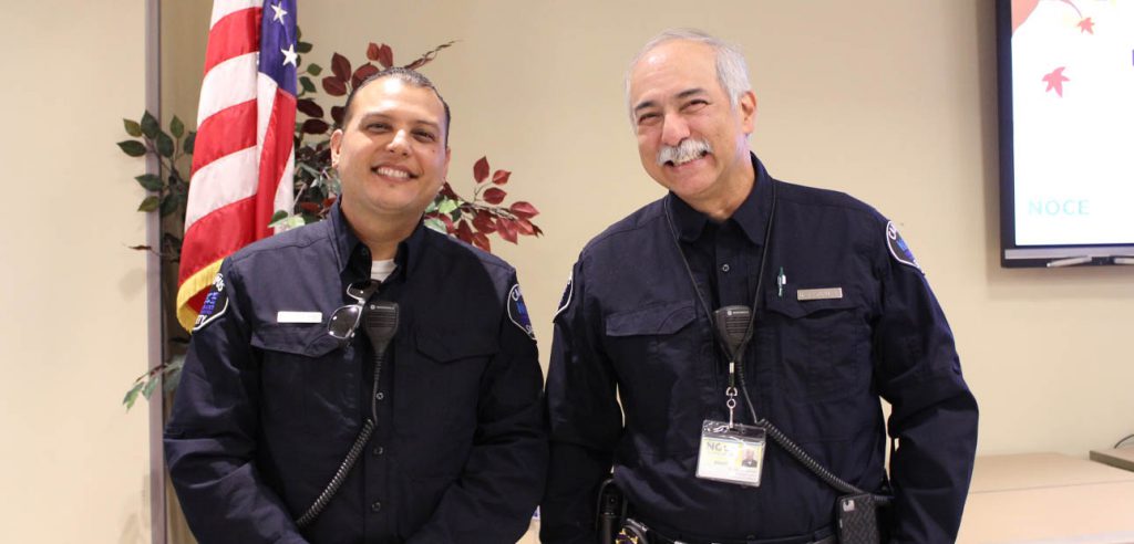 A photo of two of the on-duty security offices at the 2019 Fall Open House event. 