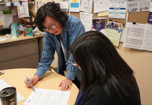 A NOCE counselor helping a student at a counseling appointment