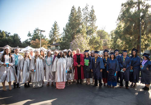 A large group of students in their graduation cap and gown