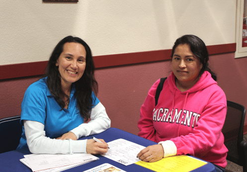 A NOCE counselor and a student smiling for the camera
