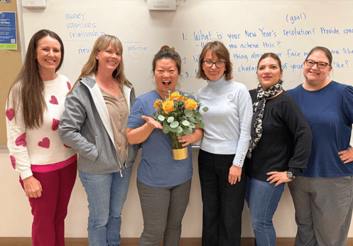 A group photo, with Helen Serrano, NOCE’s 2026 Teacher of the Year Nominee, NOCE President Valentina Purtell and other staff/faculty.