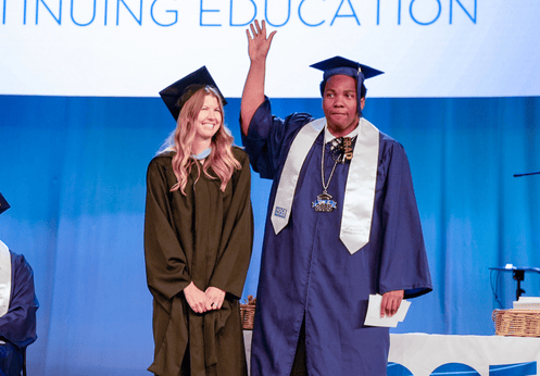 DSS counselor and DSS Award winning student on stage