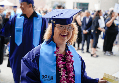 Excited and smiling graduating DSS Student