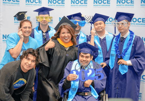 DSS counselor, and teachers posing with a group of their graduating DSS students.