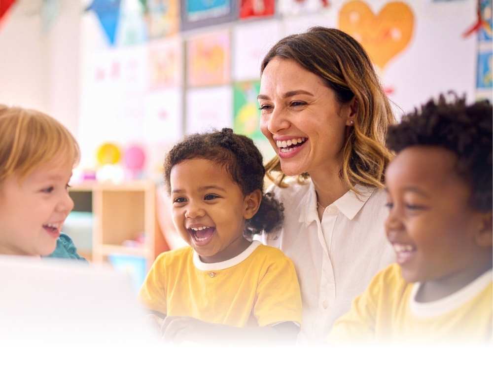 Preschool teacher interacting with children in class.